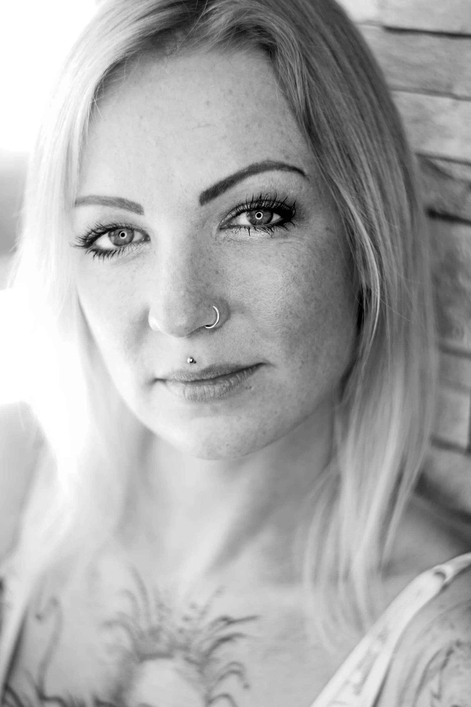 Black and white close up portrait shoulder tattoo